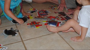 Itty Bitty and Mini Moose disagree over how to put together a floor puzzle!